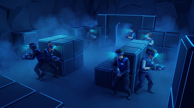 Illustration: zwei Teams mit VR-Brillen in Deckung hinter Blöcken in einer dunklen Arena